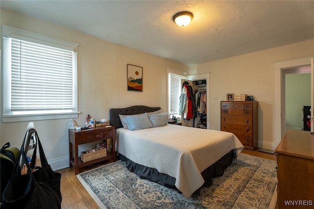 180 Lovering Ave, Buffalo, NY 14216 - bedroom featuring light wood-type flooring and a closet