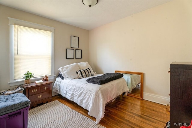 180 Lovering Ave, Buffalo, NY 14216 - bedroom with multiple windows and wood finished floors