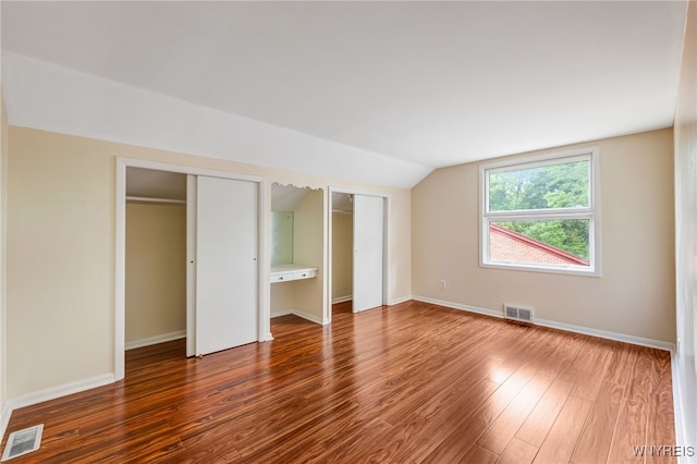35 Kendale Rd, Cheektowaga, NY 14215 - unfurnished bedroom with two closets, vaulted ceiling, and wood finished floors