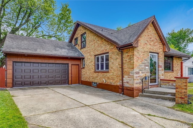 35 Kendale Rd, Cheektowaga, NY 14215 - view of front of property featuring concrete driveway, roof with shingles, an attached garage, brick siding, and stone siding
