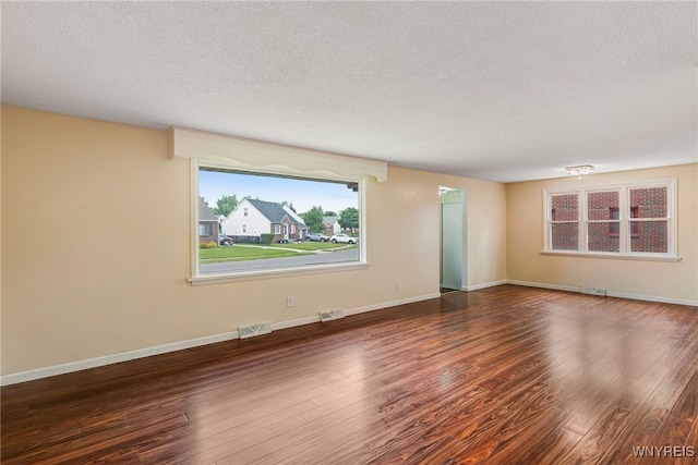 35 Kendale Rd, Cheektowaga, NY 14215 - spare room featuring a textured ceiling and wood finished floors