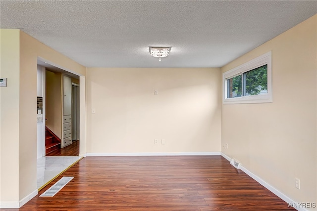 35 Kendale Rd, Cheektowaga, NY 14215 - empty room with wood finished floors and a textured ceiling