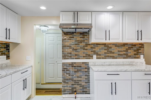 35 Kendale Rd, Cheektowaga, NY 14215 - kitchen with light stone counters, white cabinets, decorative backsplash, and recessed lighting