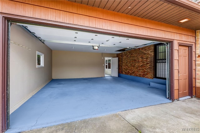35 Kendale Rd, Cheektowaga, NY 14215 - garage featuring a garage door opener and driveway