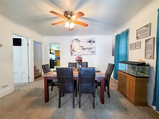 149 Post Ave, Rochester, NY 14619 - carpeted dining area featuring ornamental molding, stairway, and ceiling fan