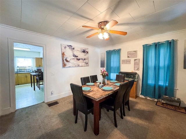 149 Post Ave, Rochester, NY 14619 - dining space featuring ornamental molding, carpet floors, and a ceiling fan