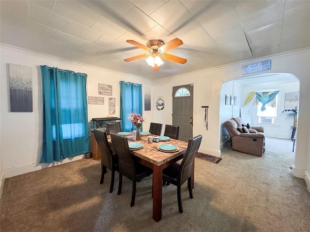 149 Post Ave, Rochester, NY 14619 - dining area with arched walkways, carpet floors, ceiling fan, and ornamental molding
