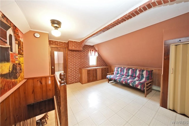 236 Weimar St, Buffalo, NY 14206 - living area with vaulted ceiling, wainscoting, brick wall, and baseboard heating