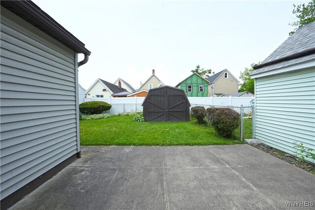 236 Weimar St, Buffalo, NY 14206 - fenced backyard with a storage shed and a patio