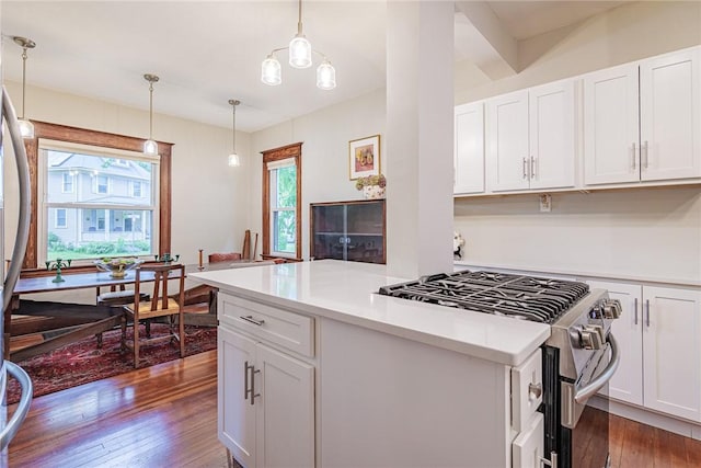 70 Field St, Rochester, NY 14620 - kitchen featuring gas range, dark wood-style flooring, and white cabinets