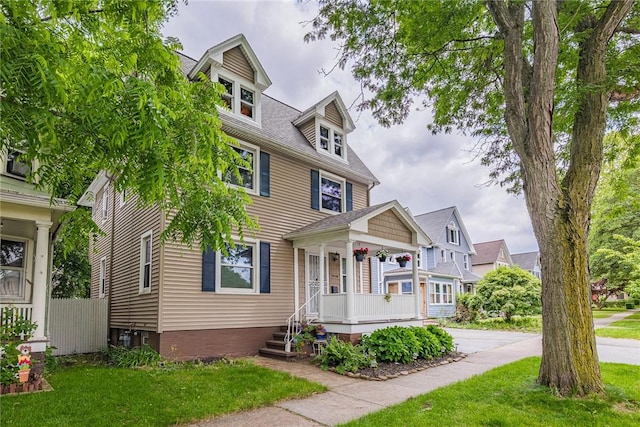70 Field St, Rochester, NY 14620 - traditional style home with a porch and a front lawn