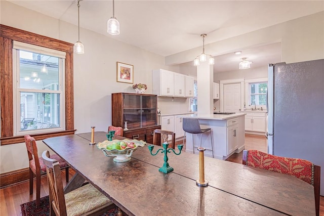 70 Field St, Rochester, NY 14620 - dining area with light wood-style flooring and baseboards