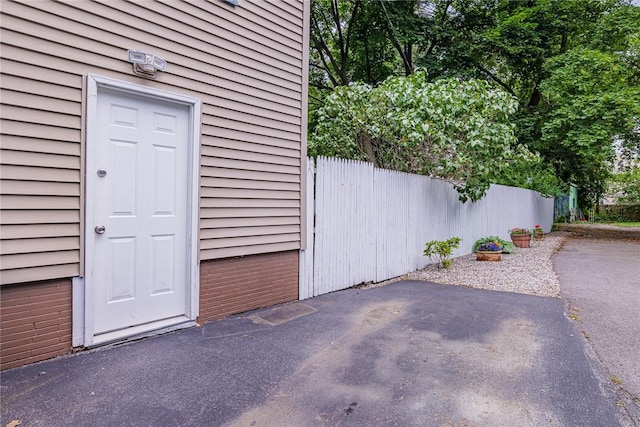 70 Field St, Rochester, NY 14620 - view of exterior entry with a patio
