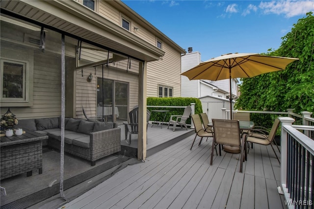 197 Shellridge Dr, Amherst, NY 14051 - wooden terrace featuring outdoor dining space, an outdoor living space, and a storage unit