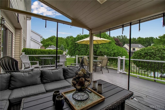 197 Shellridge Dr, Amherst, NY 14051 - sunroom / solarium with outdoor lounge area, vaulted ceiling, outdoor dining space, and view of scattered trees