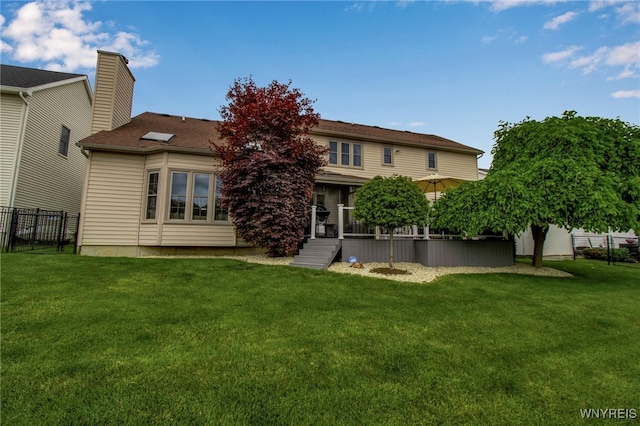 197 Shellridge Dr, Amherst, NY 14051 - back of house featuring a chimney and a wooden deck