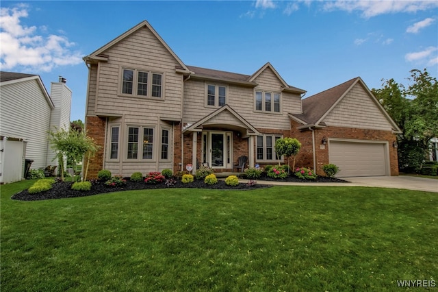 197 Shellridge Dr, Amherst, NY 14051 - view of front of home featuring brick siding, a garage, driveway, and a front yard