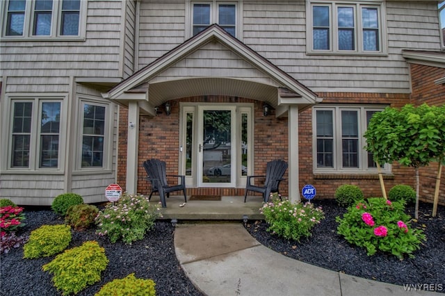 197 Shellridge Dr, Amherst, NY 14051 - doorway to property featuring brick siding and covered porch