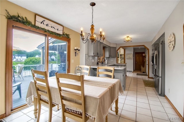 197 Shellridge Dr, Amherst, NY 14051 - dining space featuring a chandelier and light tile patterned flooring