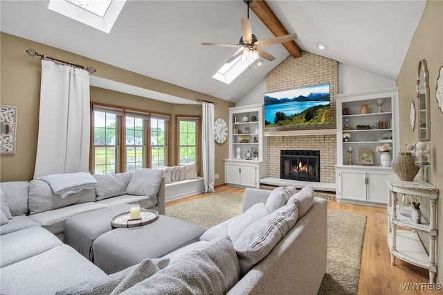 197 Shellridge Dr, Amherst, NY 14051 - living room featuring a skylight, light wood finished floors, and a ceiling fan