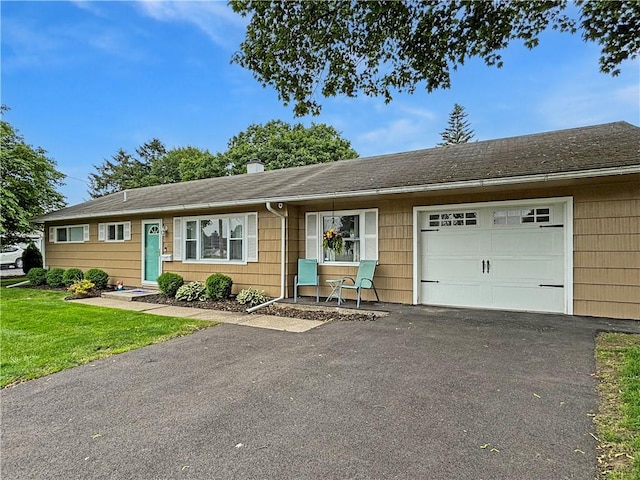 133 Berkley Ln, Horseheads, NY 14845 - ranch-style house with asphalt driveway, a garage, a front yard, and a shingled roof