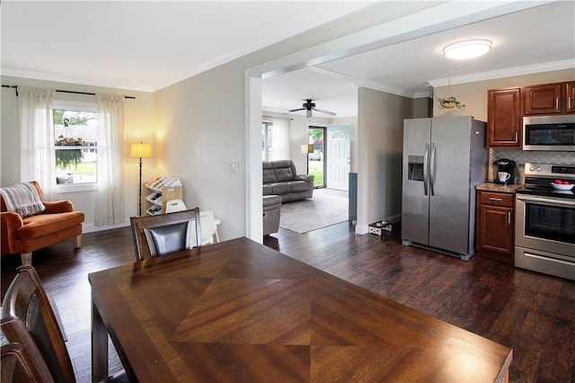 133 Berkley Ln, Horseheads, NY 14845 - dining room featuring dark wood-style flooring, a ceiling fan, and crown molding