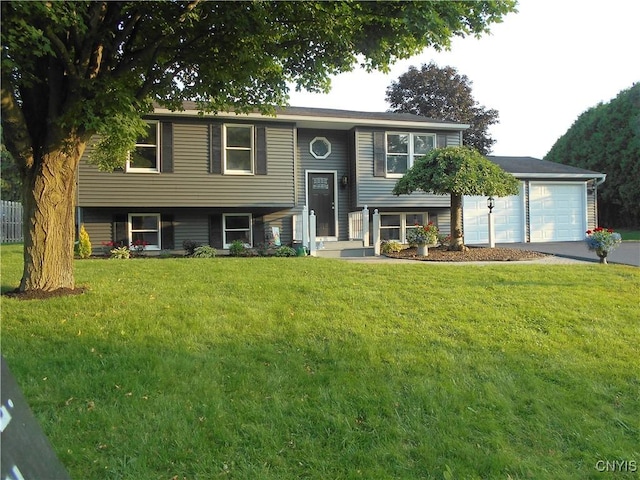 1003 Rondo Ave, Sullivan, NY 13037 - bi-level home featuring asphalt driveway, a front yard, and a garage