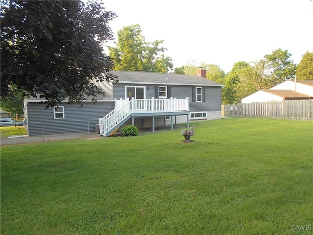1003 Rondo Ave, Sullivan, NY 13037 - rear view of property featuring a deck, stairway, a fenced backyard, and a chimney