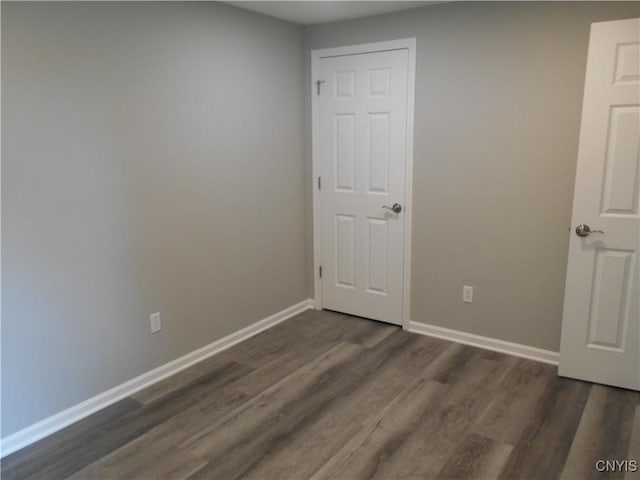 1003 Rondo Ave, Sullivan, NY 13037 - spare room featuring dark wood-type flooring and baseboards