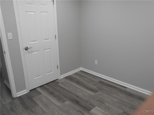 1003 Rondo Ave, Sullivan, NY 13037 - empty room with dark wood-style floors and baseboards
