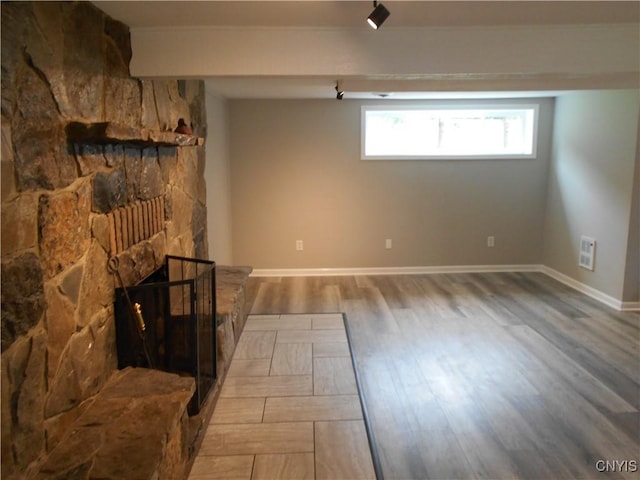 1003 Rondo Ave, Sullivan, NY 13037 - unfurnished living room featuring wood finished floors and a fireplace