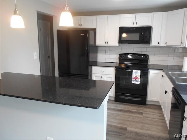 1003 Rondo Ave, Sullivan, NY 13037 - kitchen featuring black appliances, white cabinets, hanging light fixtures, and decorative backsplash