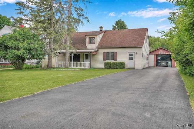 464 Rowley Rd, Cheektowaga, NY 14043 - view of front facade featuring an outdoor structure, a garage, a porch, a front lawn, and a chimney