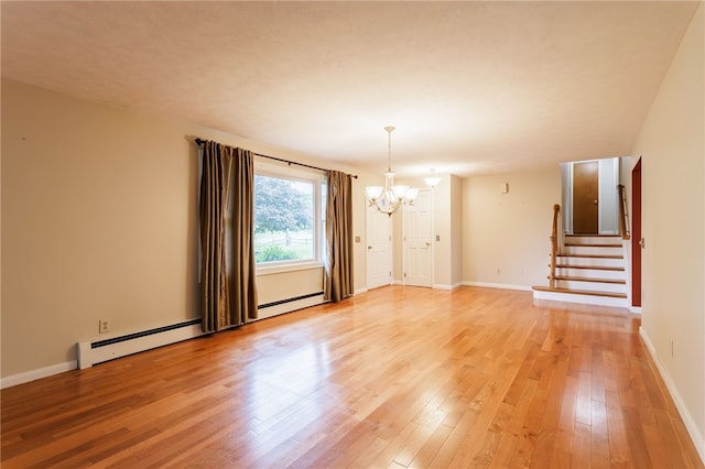 7175 Gale Rd, Lima, NY 14485 - unfurnished room with a chandelier, light wood-type flooring, stairs, and a baseboard radiator