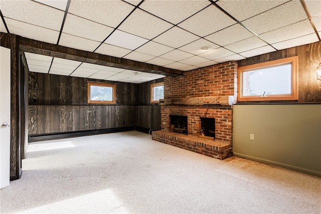 7175 Gale Rd, Lima, NY 14485 - below grade area with wood walls, a drop ceiling, a fireplace, and carpet floors