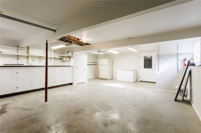 7175 Gale Rd, Lima, NY 14485 - garage featuring freestanding refrigerator and white refrigerator