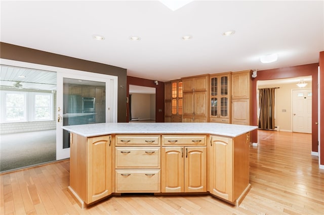 7175 Gale Rd, Lima, NY 14485 - kitchen featuring light wood-type flooring, light countertops, glass insert cabinets, light brown cabinets, and recessed lighting