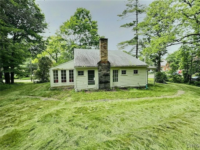 326 Main St, Ledyard, NY 13026 - back of house with a chimney and a yard