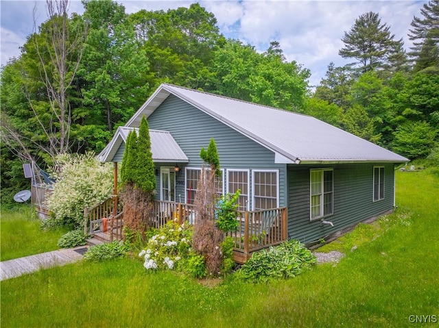 7460 State Highway 29, Oppenheim, NY 13329 - view of property exterior featuring a metal roof, a yard, and a wooden deck
