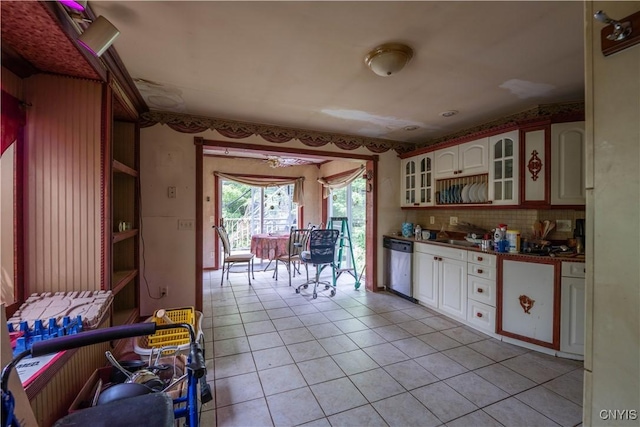 7460 State Highway 29, Oppenheim, NY 13329 - kitchen featuring dishwasher, light tile patterned flooring, dark countertops, glass insert cabinets, and white cabinetry