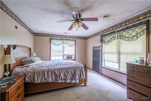 7460 State Highway 29, Oppenheim, NY 13329 - bedroom featuring multiple windows, light carpet, a ceiling fan, and cooling unit
