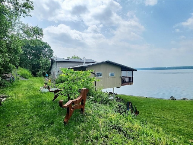 1995 Lake Rd, Ledyard, NY 13026 - rear view of property featuring a water view, a lawn, and a balcony