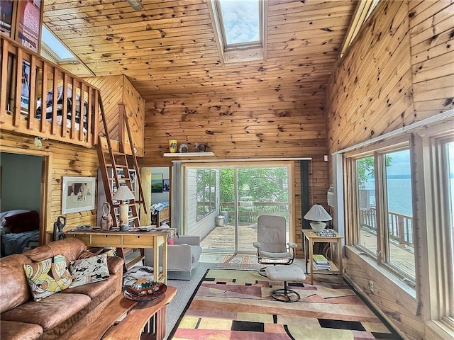 1995 Lake Rd, Ledyard, NY 13026 - living area with wood walls, a skylight, healthy amount of natural light, high vaulted ceiling, and wooden ceiling