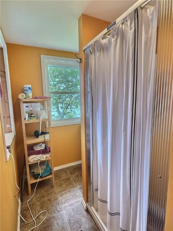 1995 Lake Rd, Ledyard, NY 13026 - full bath featuring a stall shower and baseboards