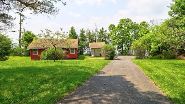 1995 Lake Rd, Ledyard, NY 13026 - view of front of property featuring a front lawn and asphalt driveway