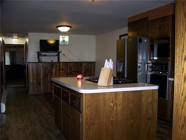 236 Covered Bridge Rd, Davenport, NY 13820 - kitchen featuring black appliances, a center island, light countertops, and dark wood-style floors
