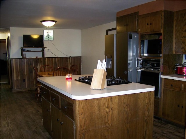 236 Covered Bridge Rd, Davenport, NY 13820 - kitchen with black appliances, dark wood-type flooring, a kitchen island, and light countertops