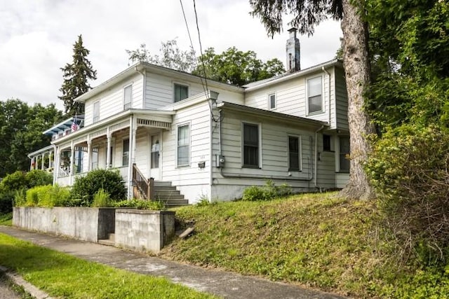 109 S Madison Ave, Dix, NY 14891 - view of front of house with covered porch and a chimney