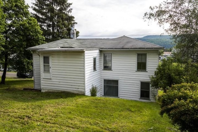 109 S Madison Ave, Dix, NY 14891 - back of house featuring a yard and a shingled roof