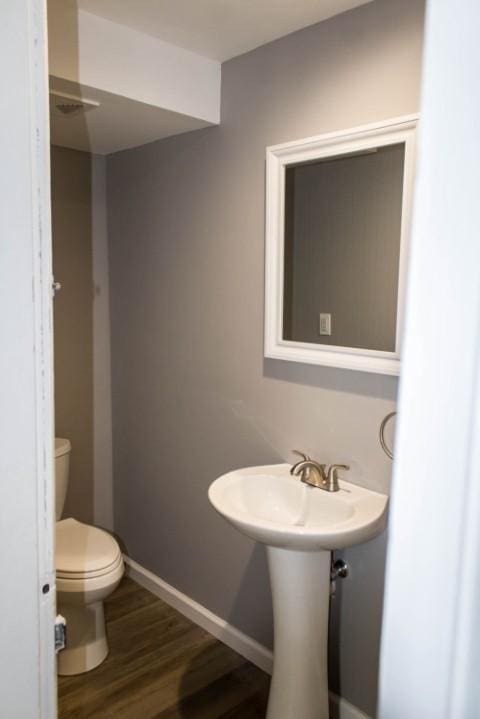109 S Madison Ave, Dix, NY 14891 - bathroom featuring toilet and wood finished floors